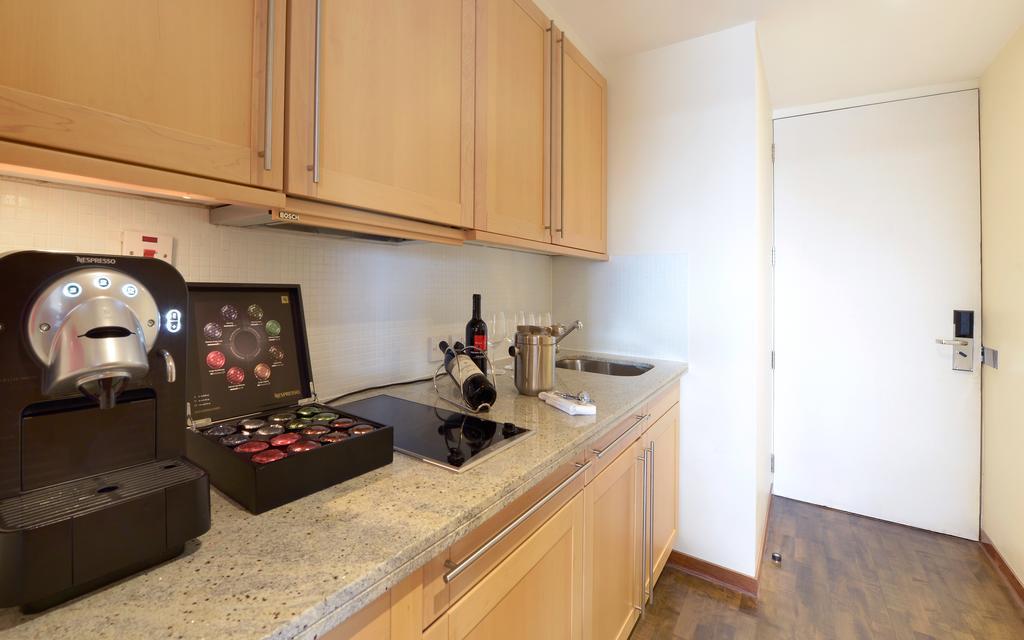 Canary Riverside Plaza Hotel London Exterior photo A typical kitchen in a student apartment